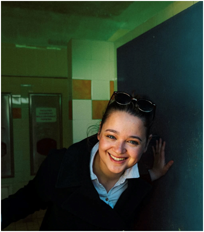 Eloise Carter looking at the camera in a corridor