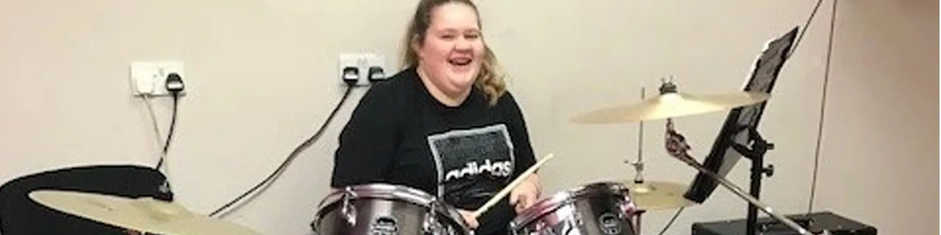 Alicia at her drum set