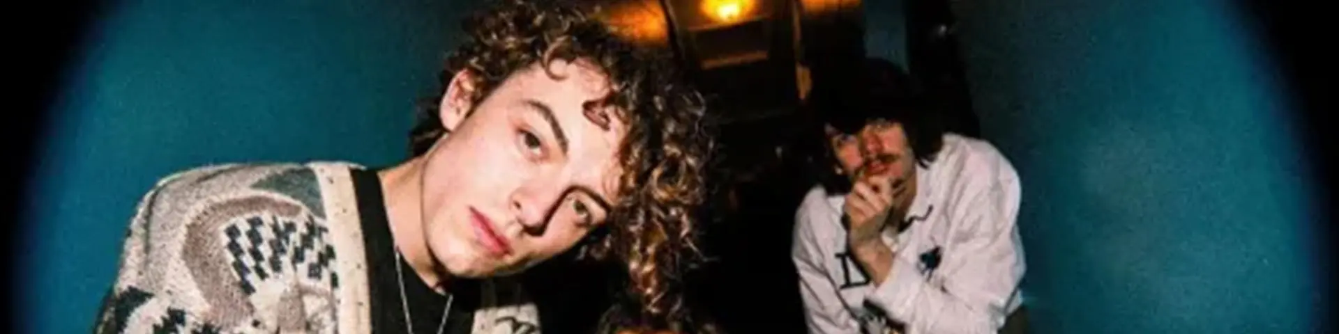 Two members of the band Pentire peering into the camera 