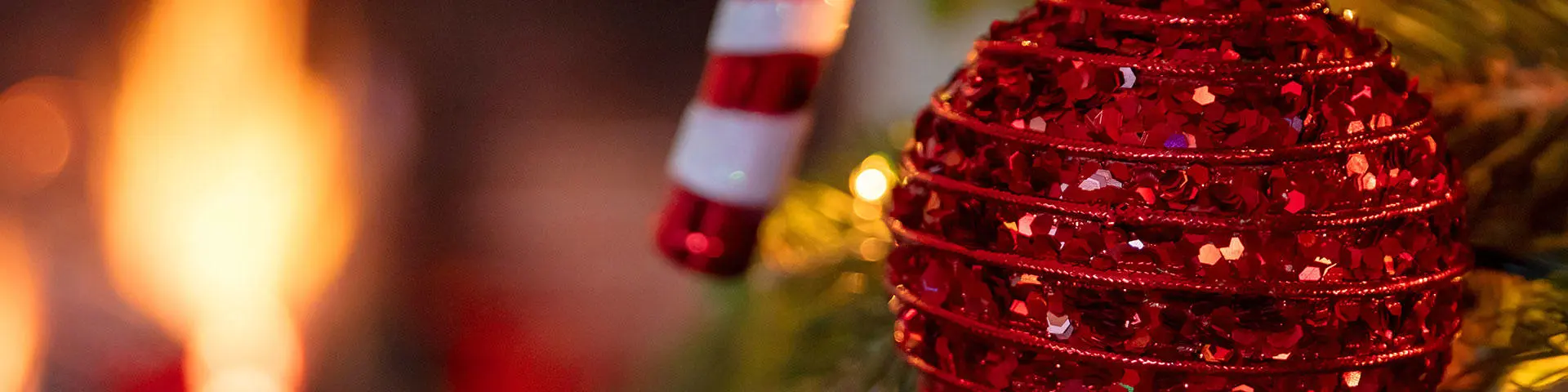 Close-up of a red sparkly bauble on a Christmas tree