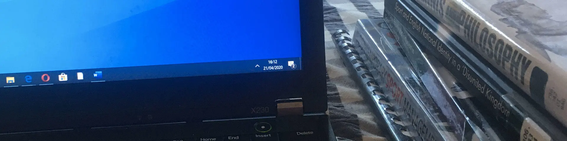 Laptop screen and text books