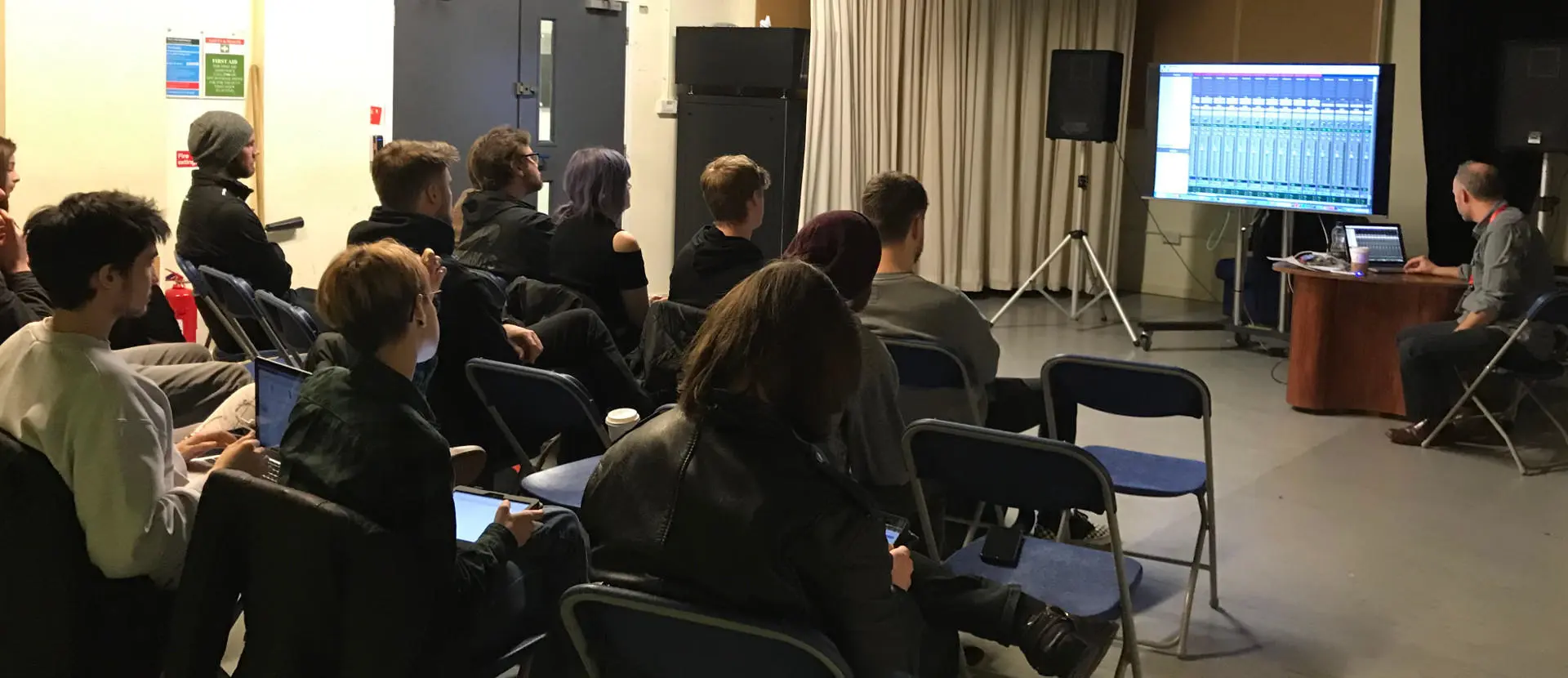 Media technology students listening to a presentation by Tudor Davies