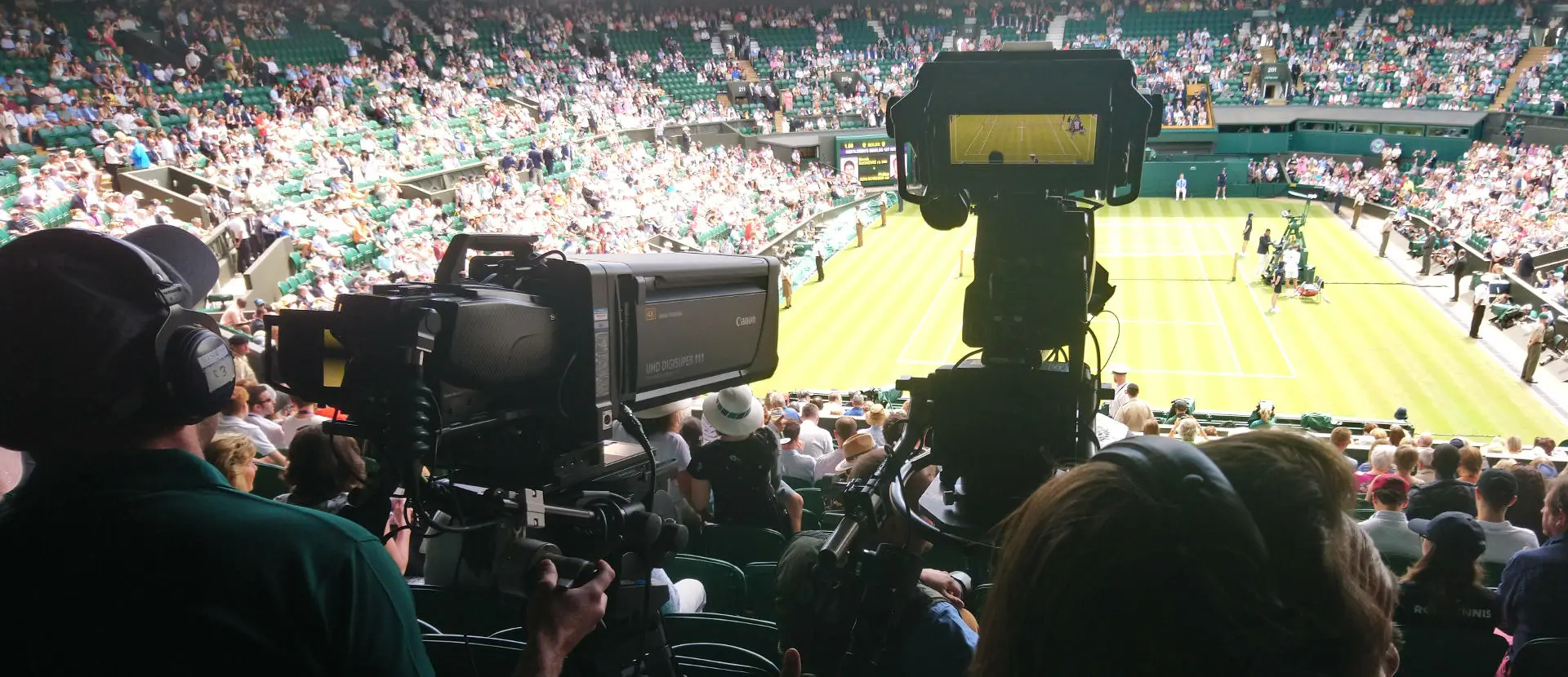 TV cameras capturing the tennis action at Wimbledon