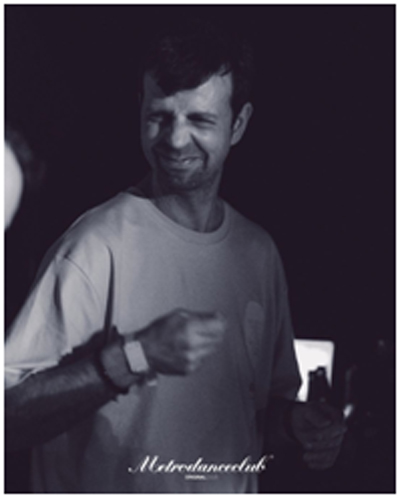 This black and white photo shows Javier in advertisement for a set in Metro Dance Club, A large clubbing venue in Spain