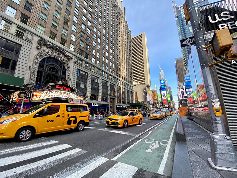 A New York street with a row of yellow cabs