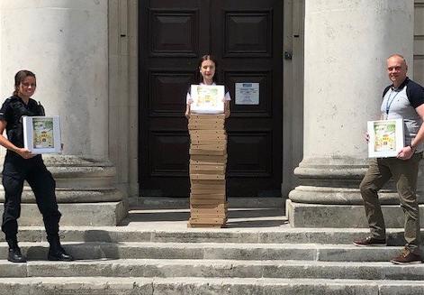 Art Pizza Boxes being handed over by Megan Smith to the VRU Team