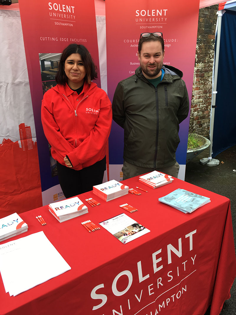 Solent representatives stood behind a Solent  branded information stand