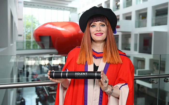 Ana Matronic with her degree in The Spark