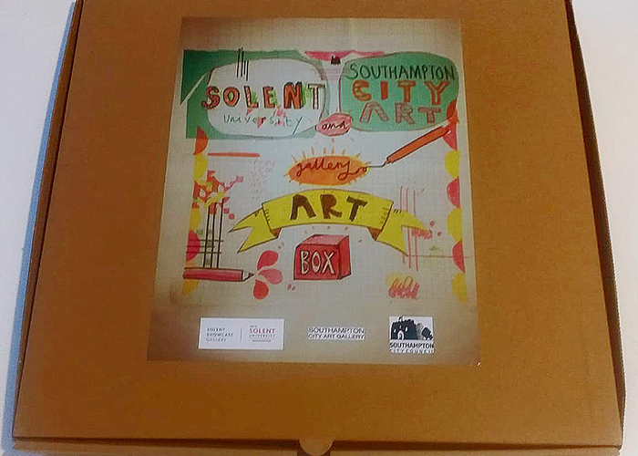 One of the pizza boxes with a drawing on