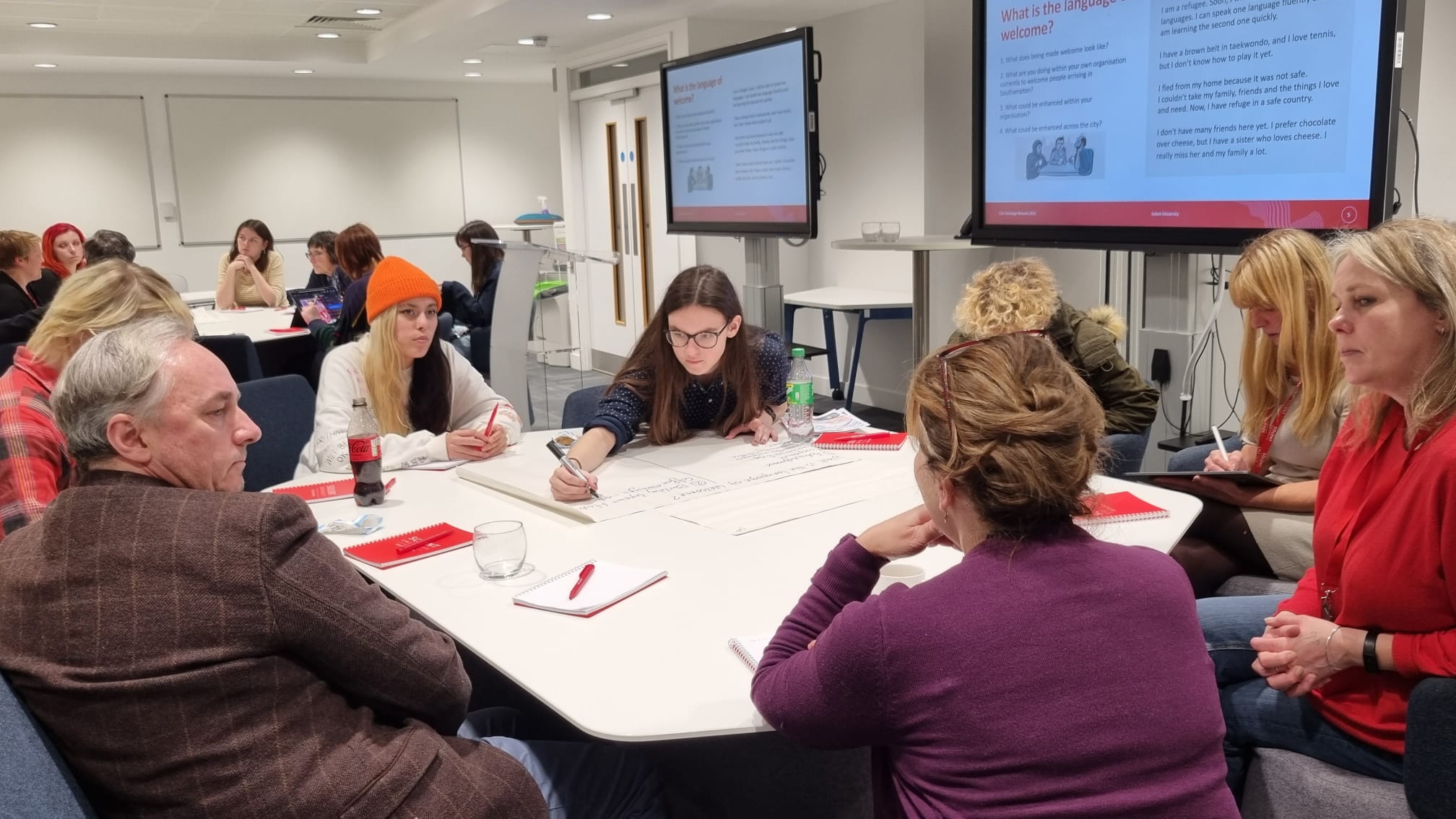 Attendees at the first Civic Exchange Network event at Solent University discussing various topics, including what the language of welcome is.
