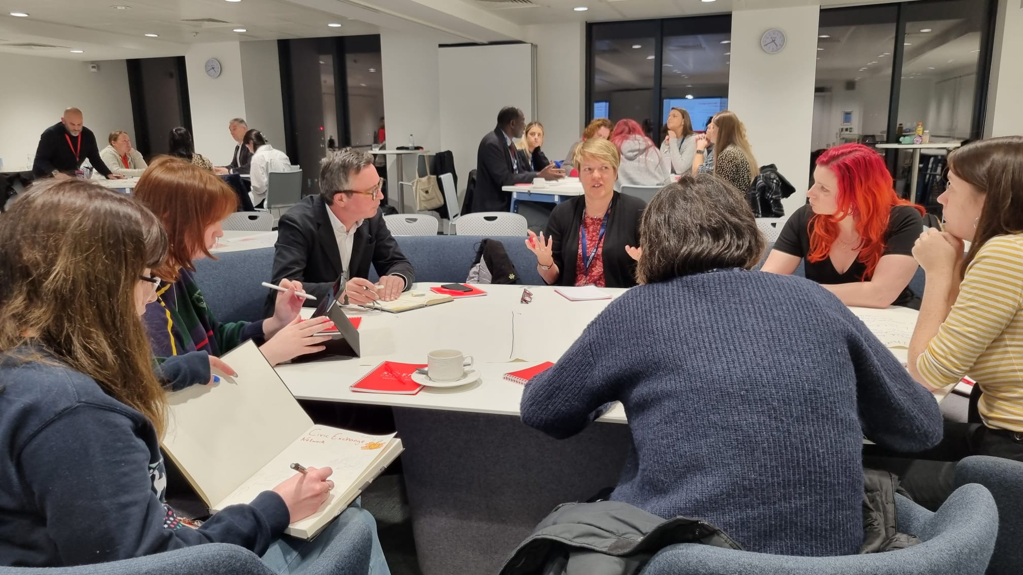 Attendees at the first Civic Exchange Network event at Solent University discussing various topics, including what the language of welcome is.