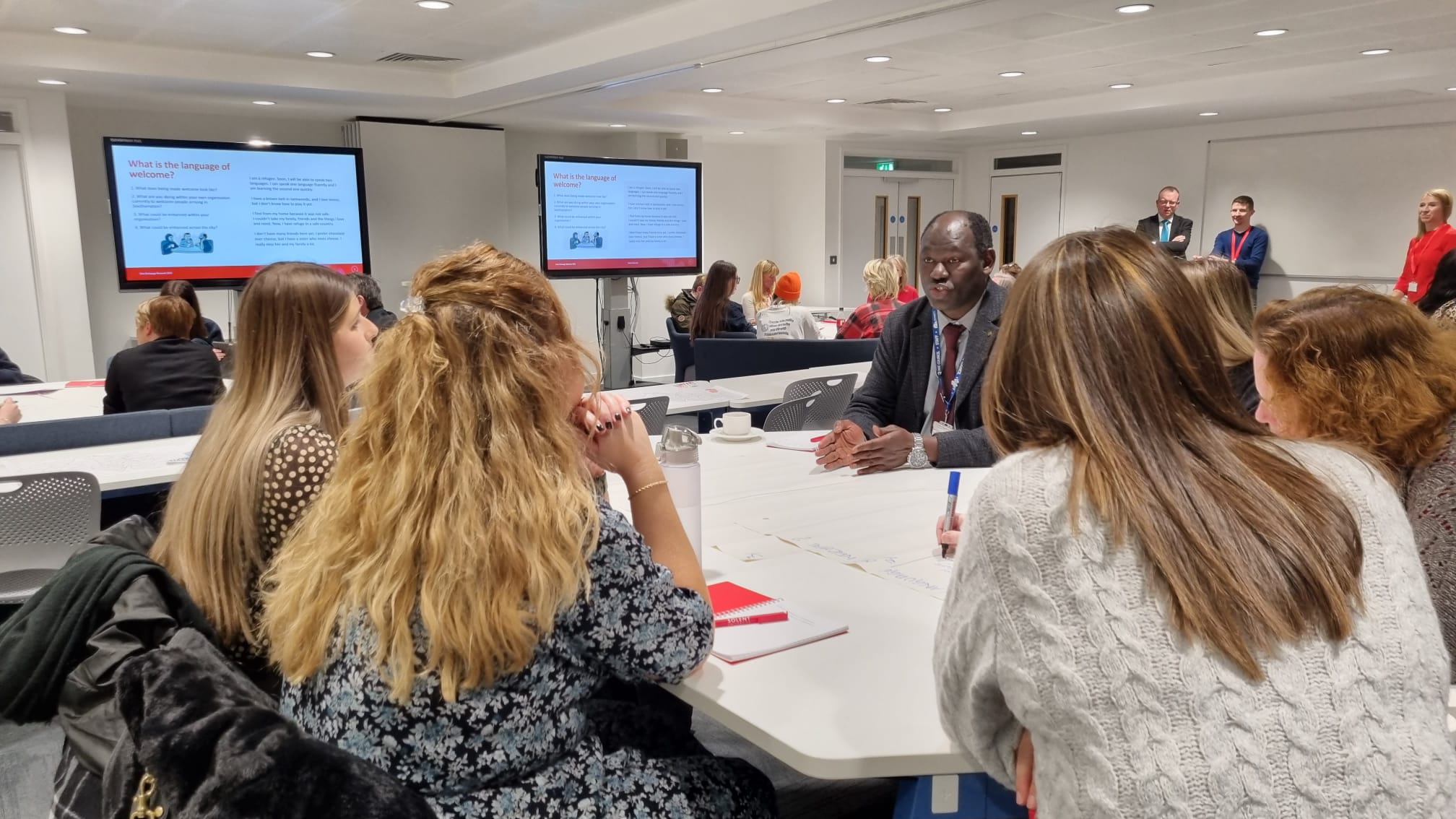 Attendees at the first Civic Exchange Network event at Solent University discussing various topics, including what the language of welcome is.