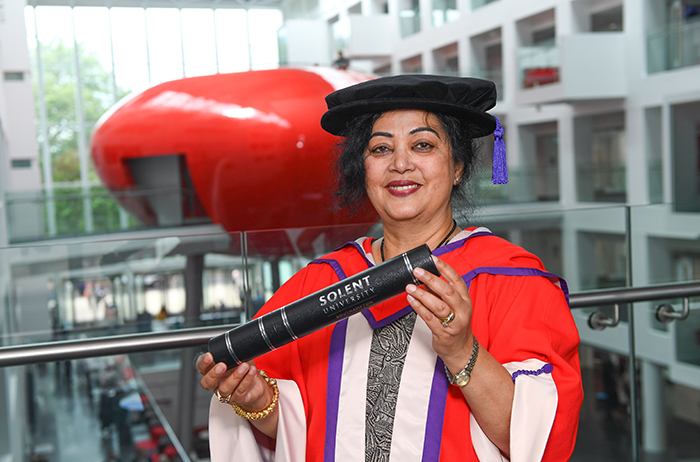 Dahlia Jamil with her degree in The Spark