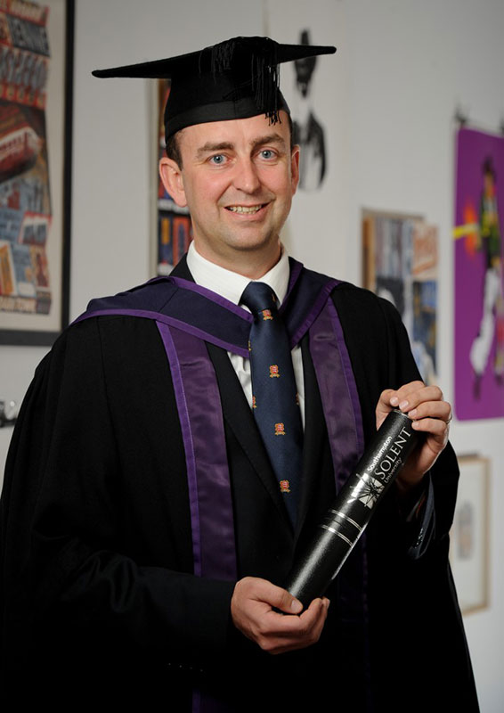 Daniel Feist with his honorary degree from Solent University