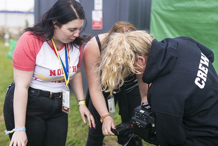 Members of Solent's crew setting up a camera
