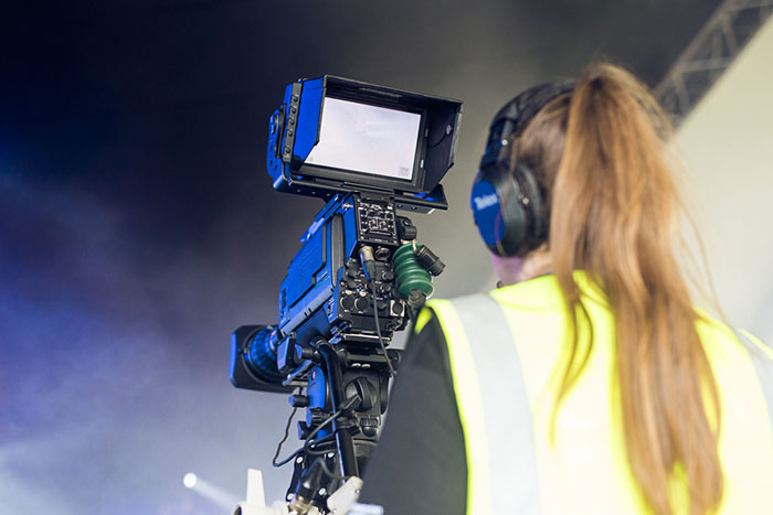 A Solent media technology student filming with a camera