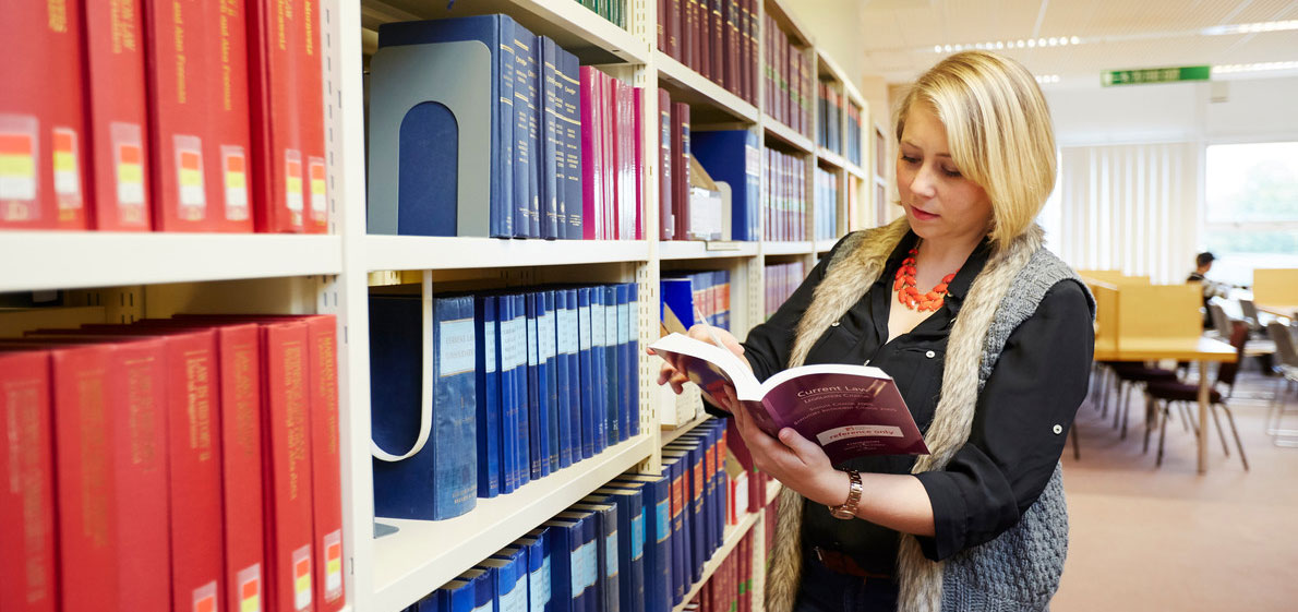 Solent student in the library