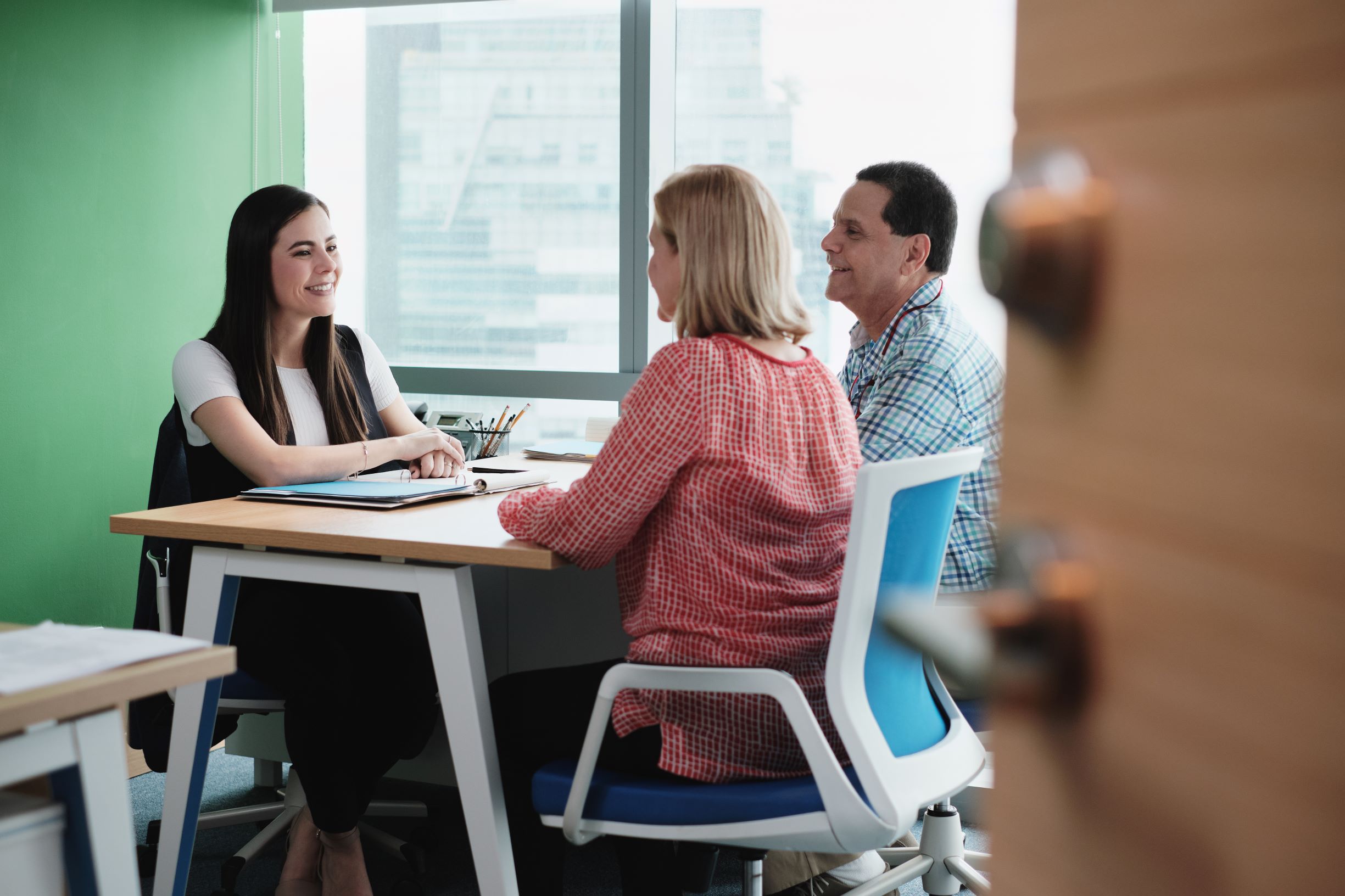 woman advising an older couple