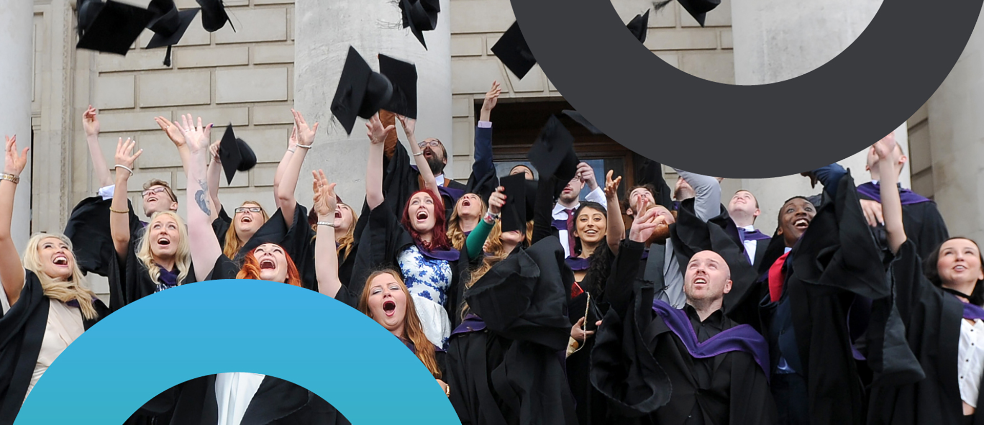 Graduates throwing their hats in the air