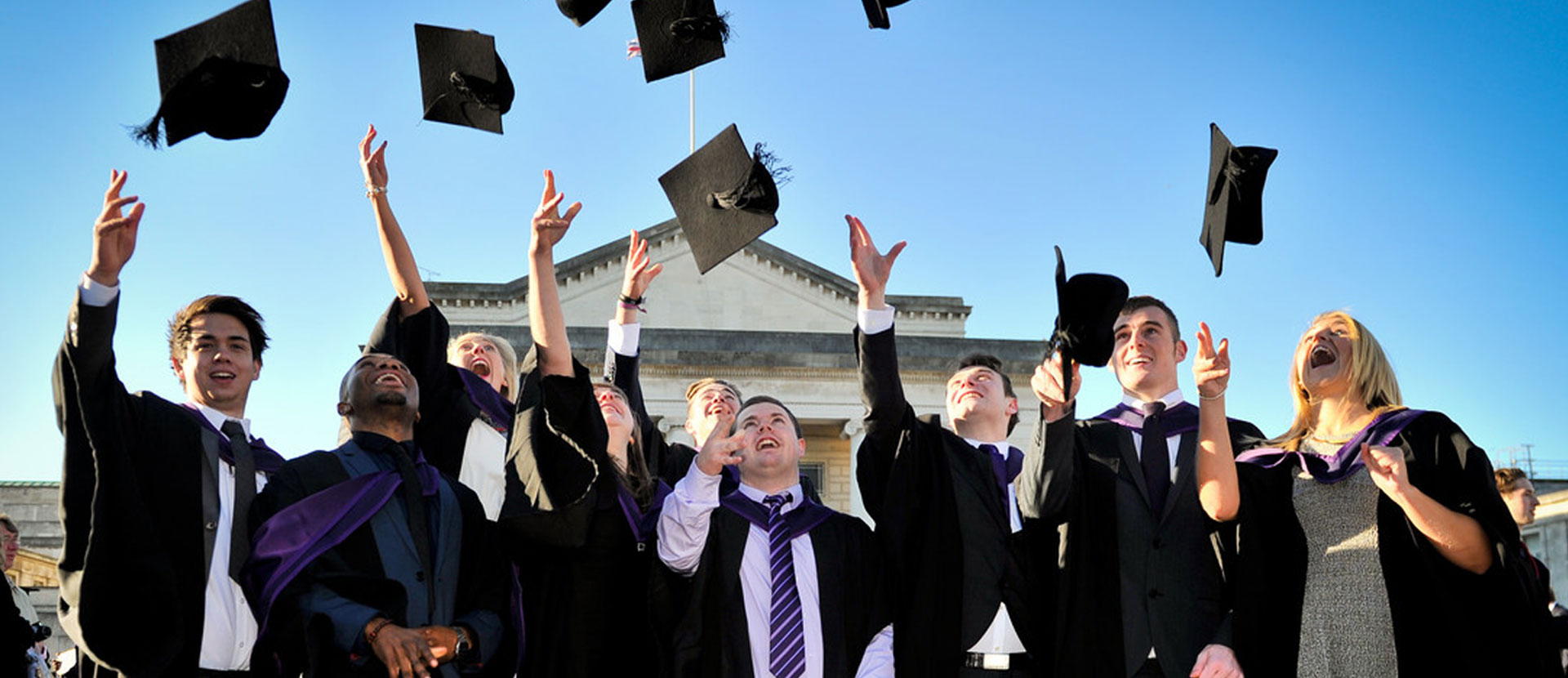 Solent graduates throwing mortar boards
