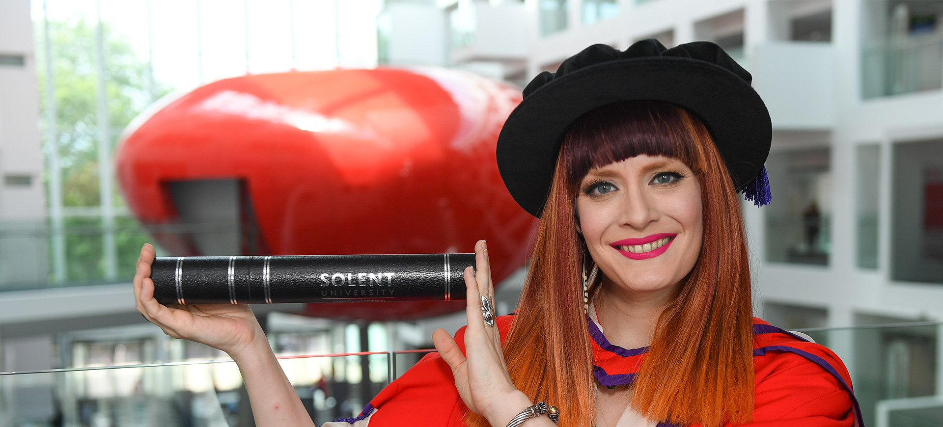 Ana Matronic holding her certificate