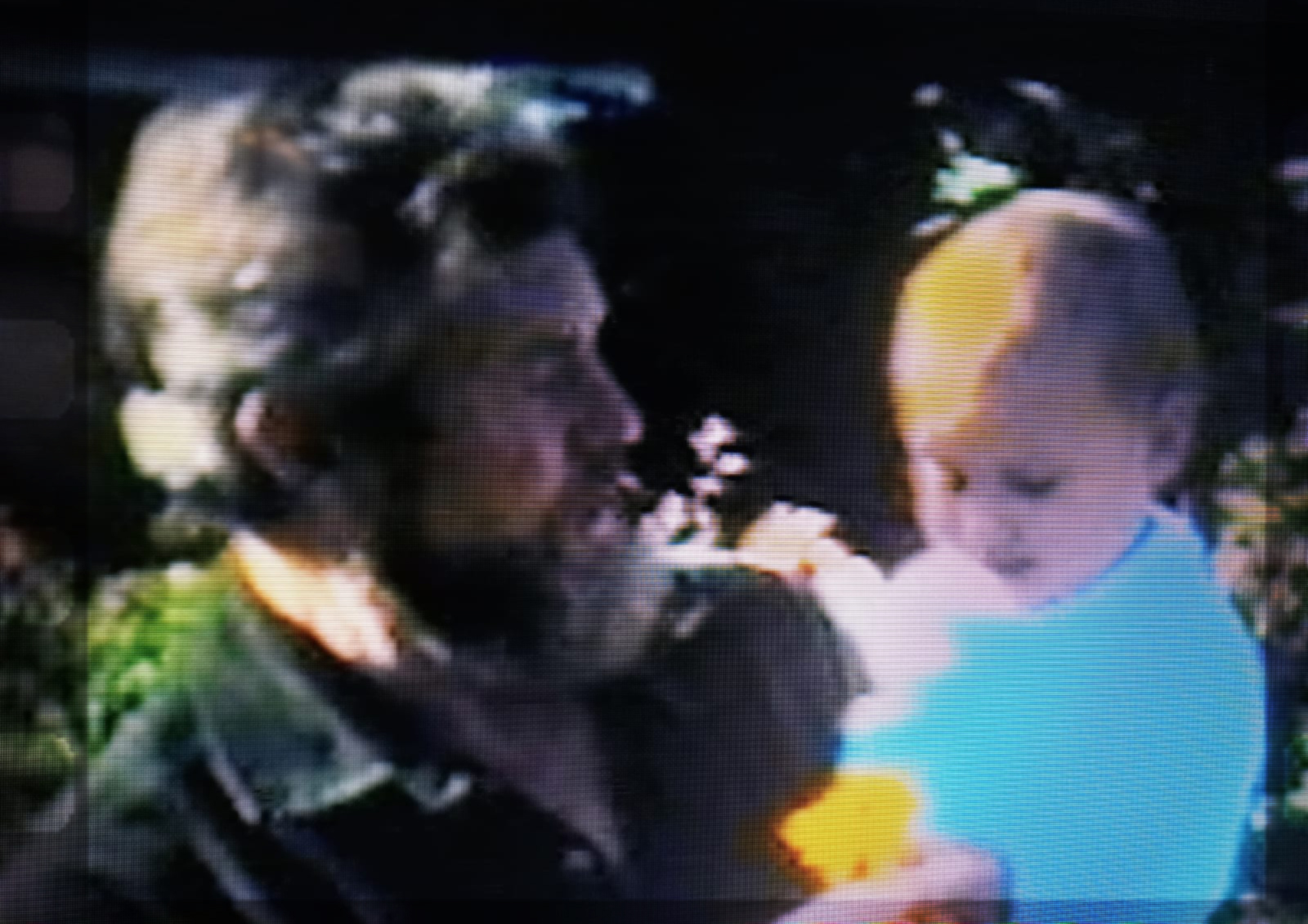 Picture of a bearded man holding a baby