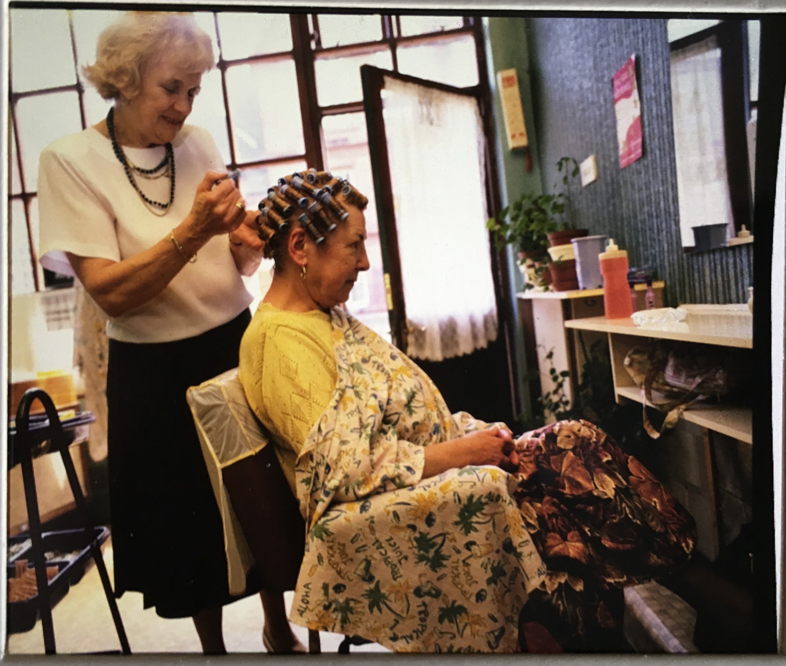 Lady getting a beehive hair style