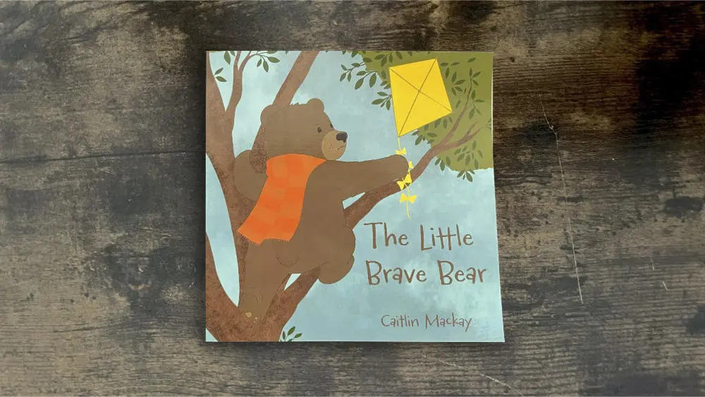 The Little Brave Bear Cover of bear in tree holding a kite