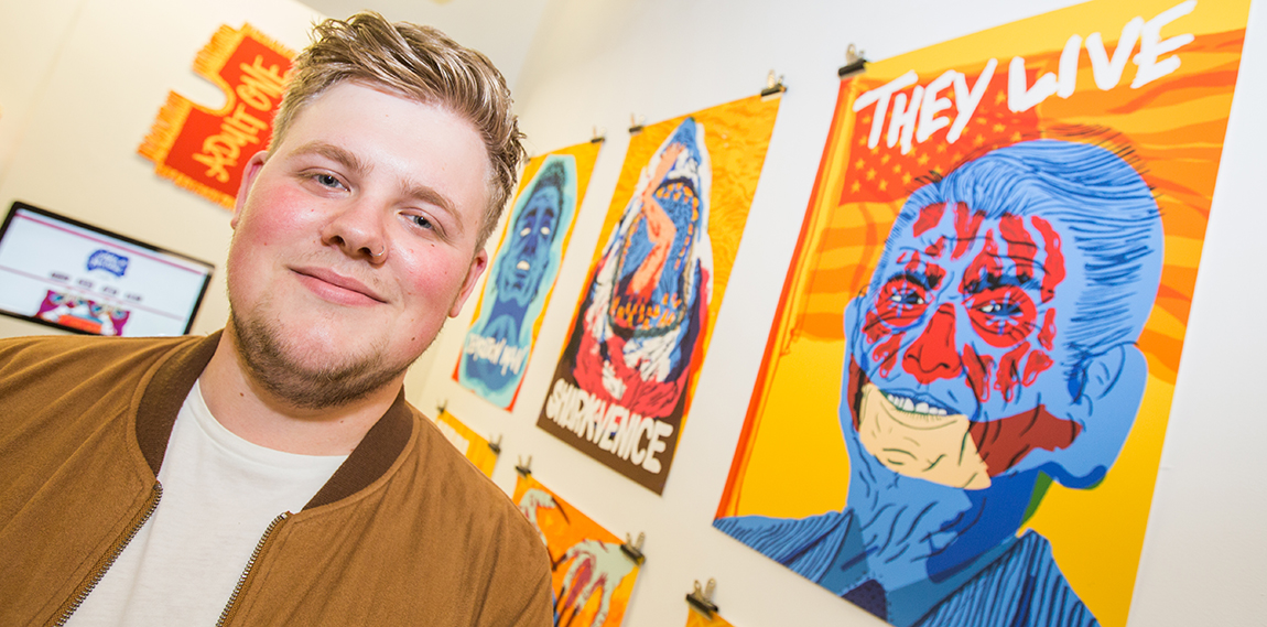 Charlie Gould in front of his work