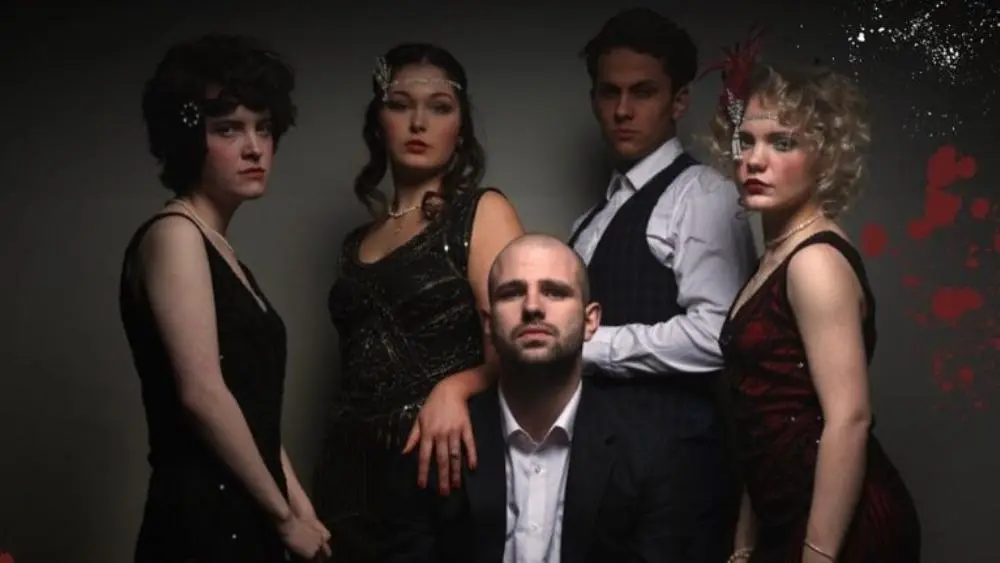 Club Mistero graduates stand in a group in 1950's outfits