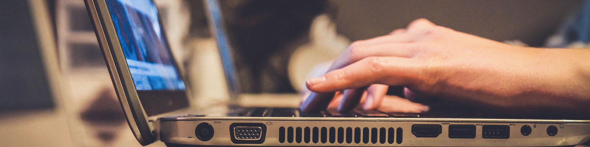 A person typing on a laptop