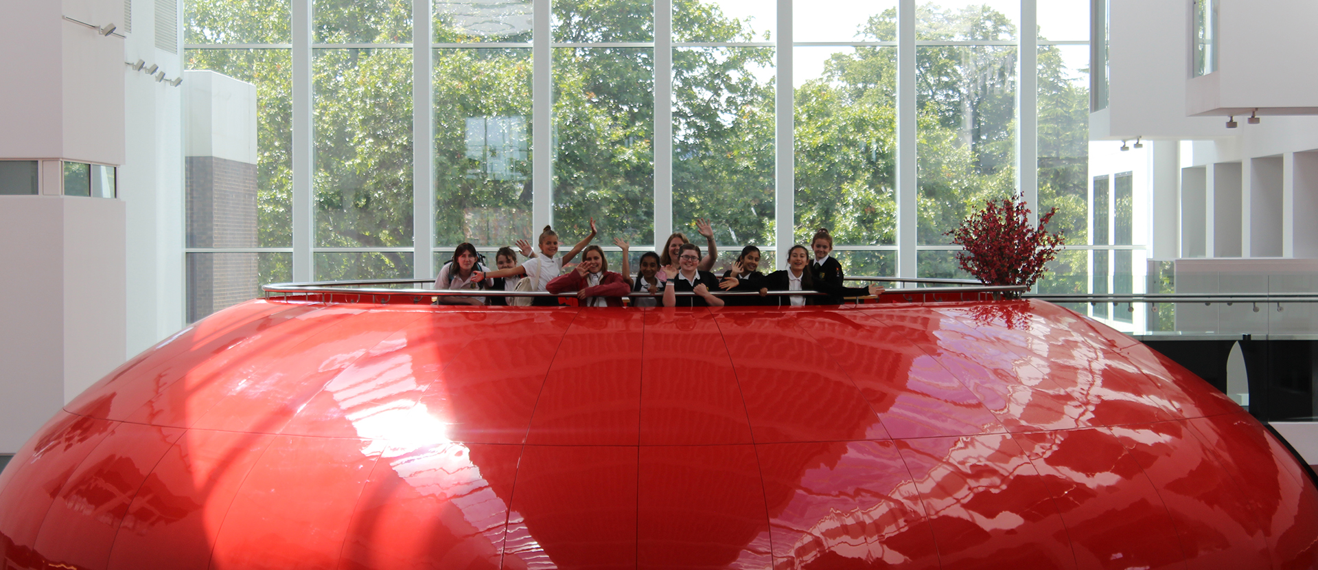 Students on top of The Spark cheering