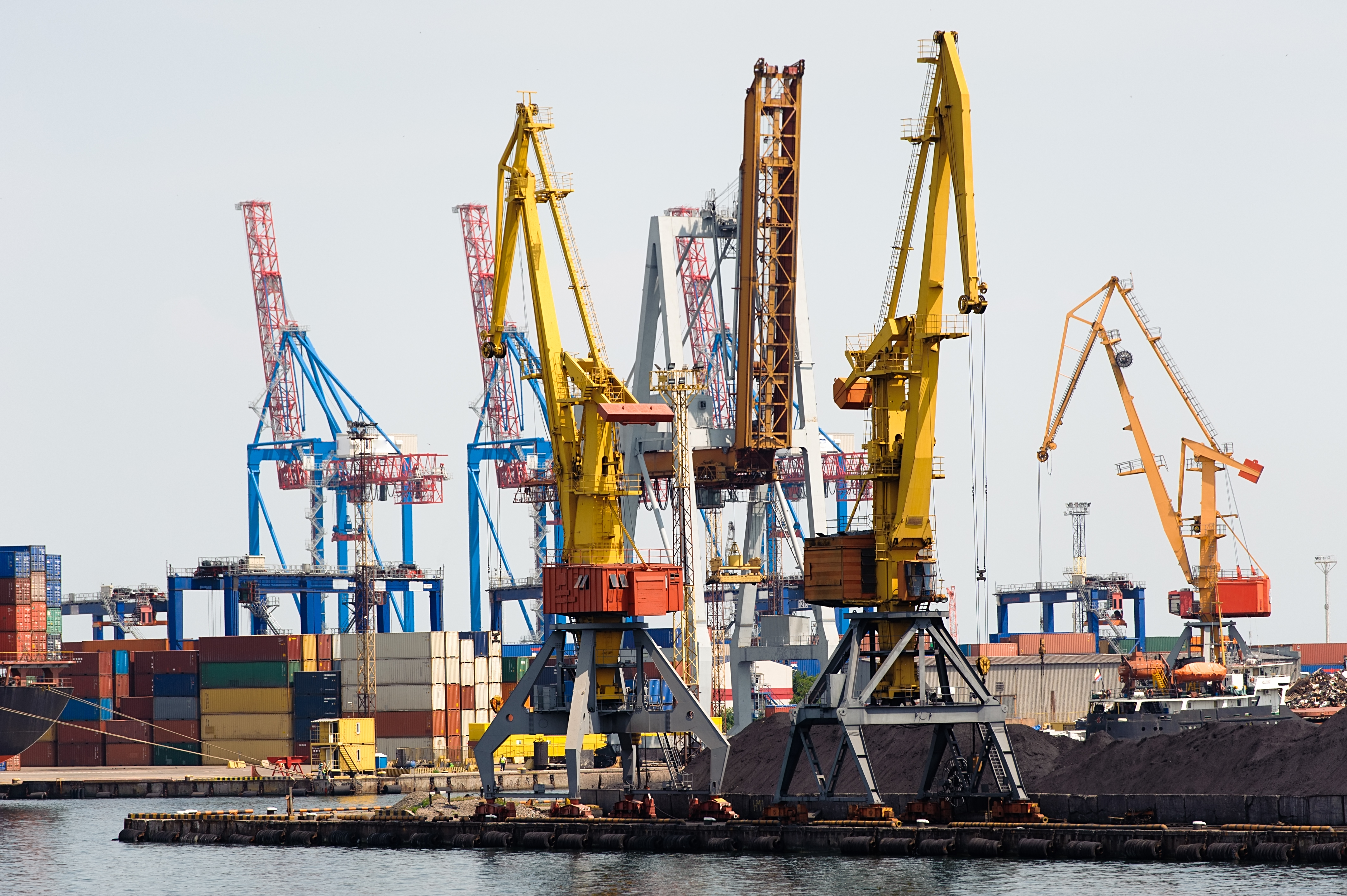 Cranes and containers on the shoreside of a port