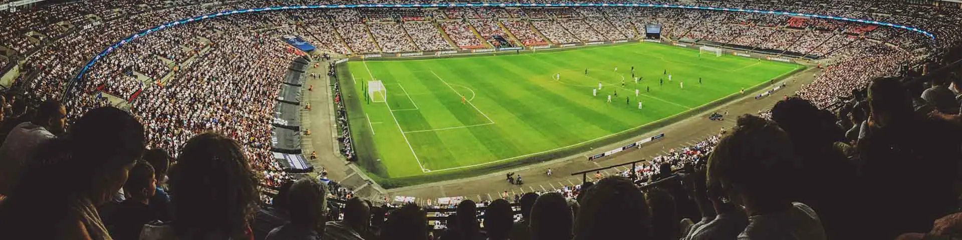 Large football stadium packed with spectators