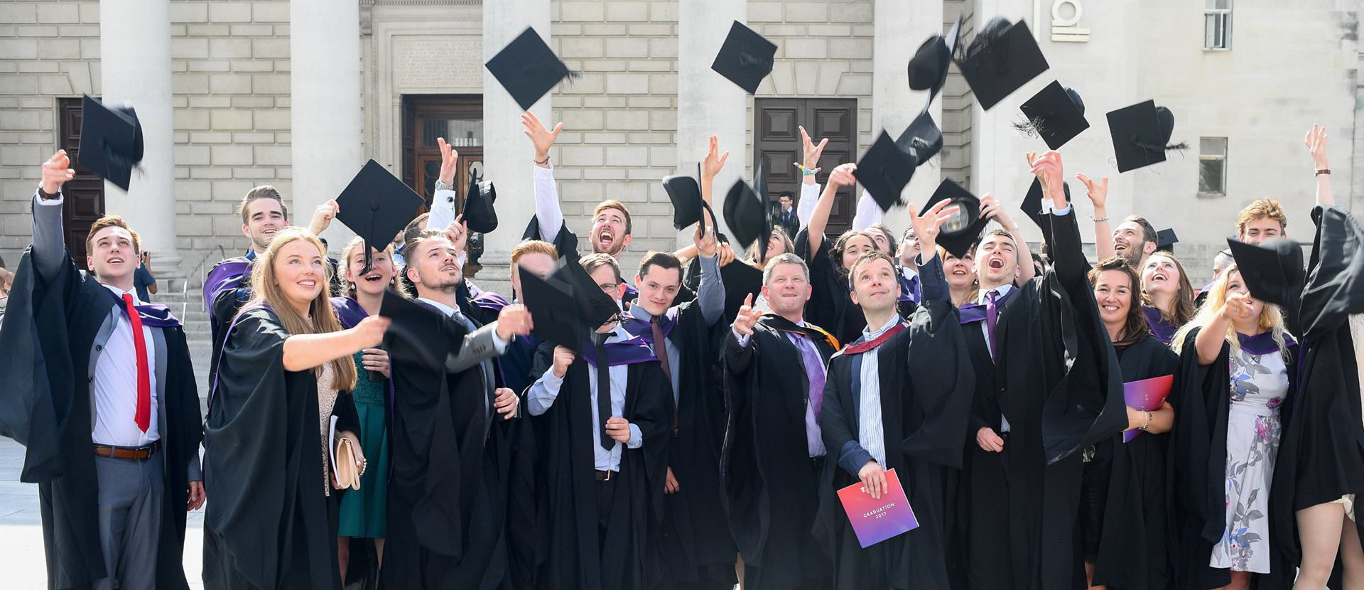 Graduates throwing their hats in the air