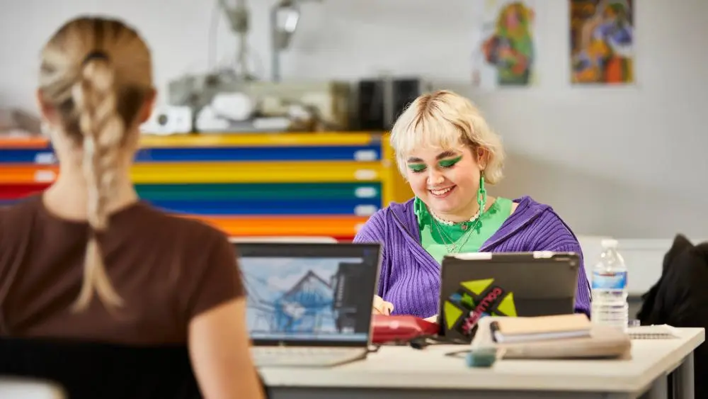 Two students laughing
