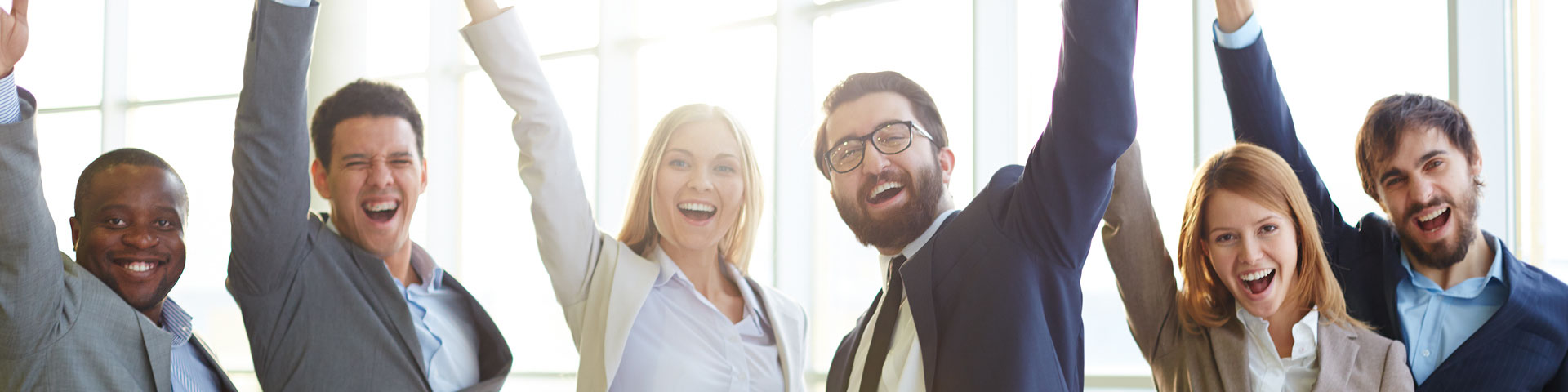 a group of cheering people in suits