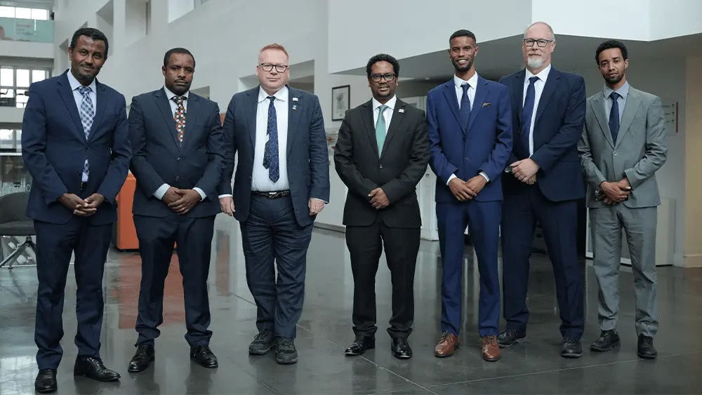 A group of seven men stood together in The Spark Atrium.