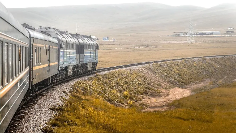 A train travels through the countryside