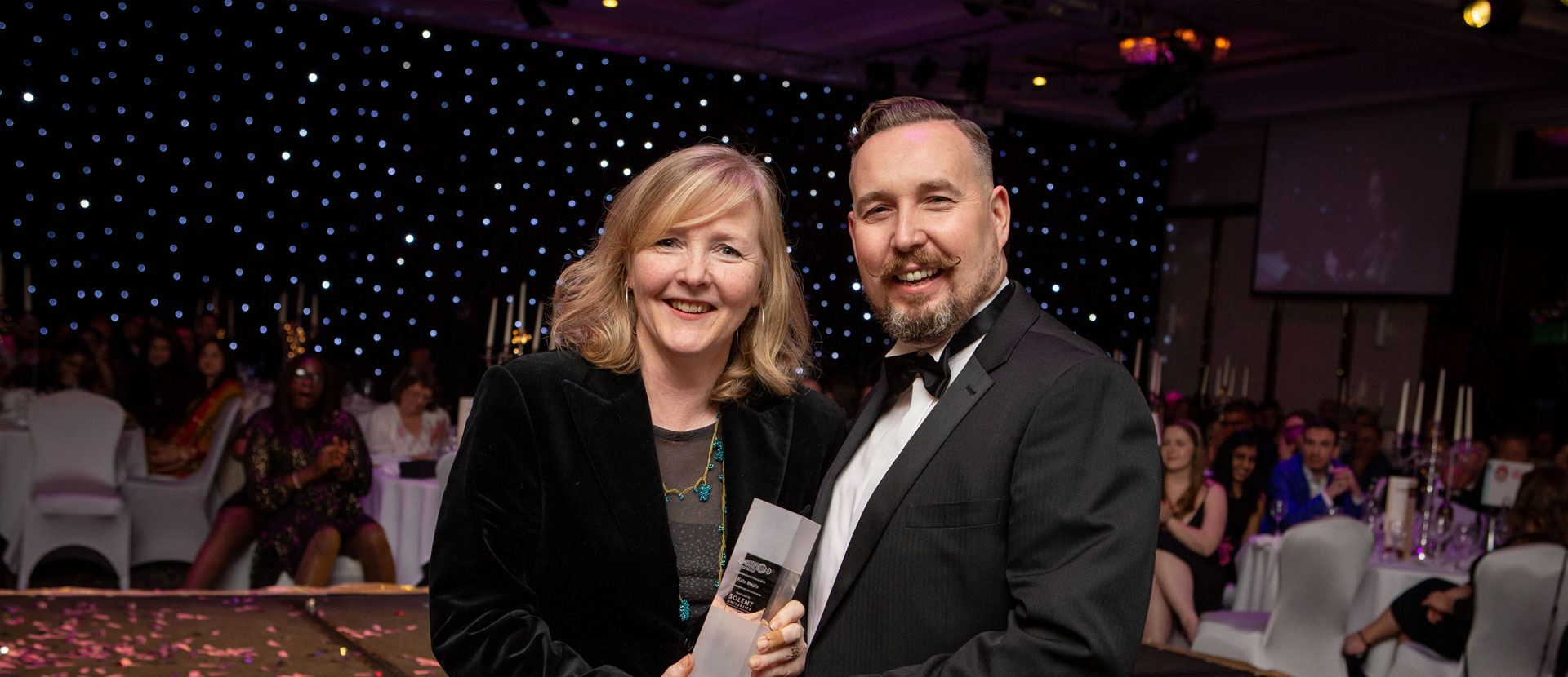 Kate Maple receives her award from Professor Peter Lloyd