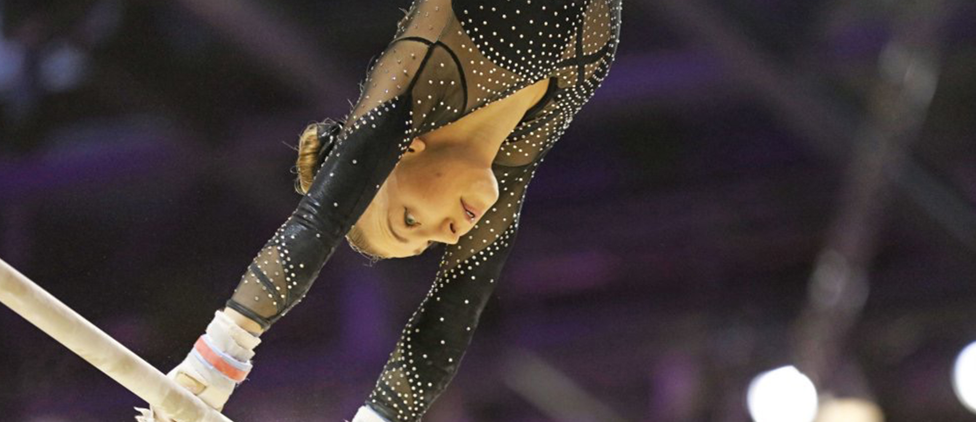 Kelly Simm on the uneven bars