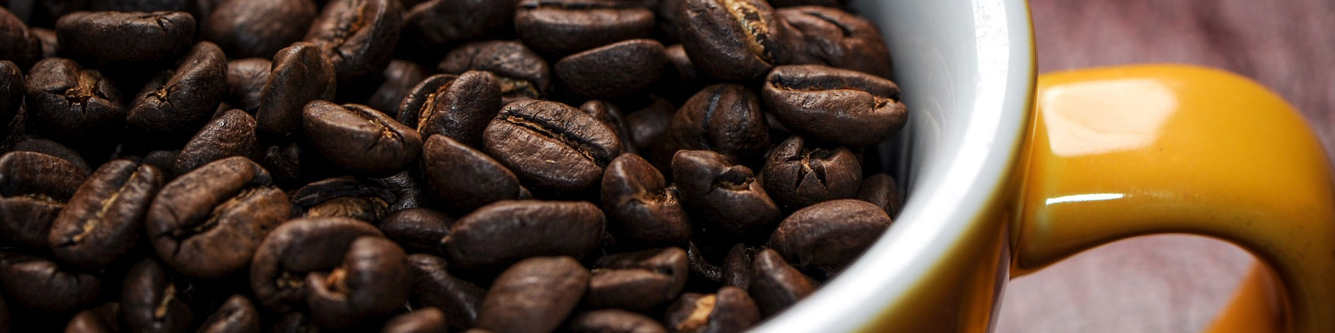 Coffee cup with coffee beans