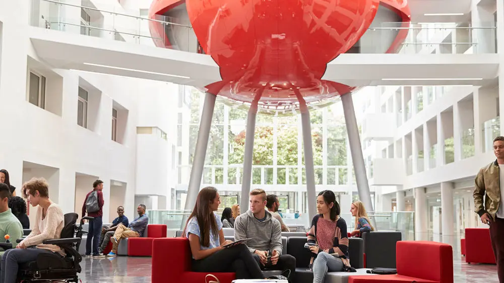 Students working in the Spark building