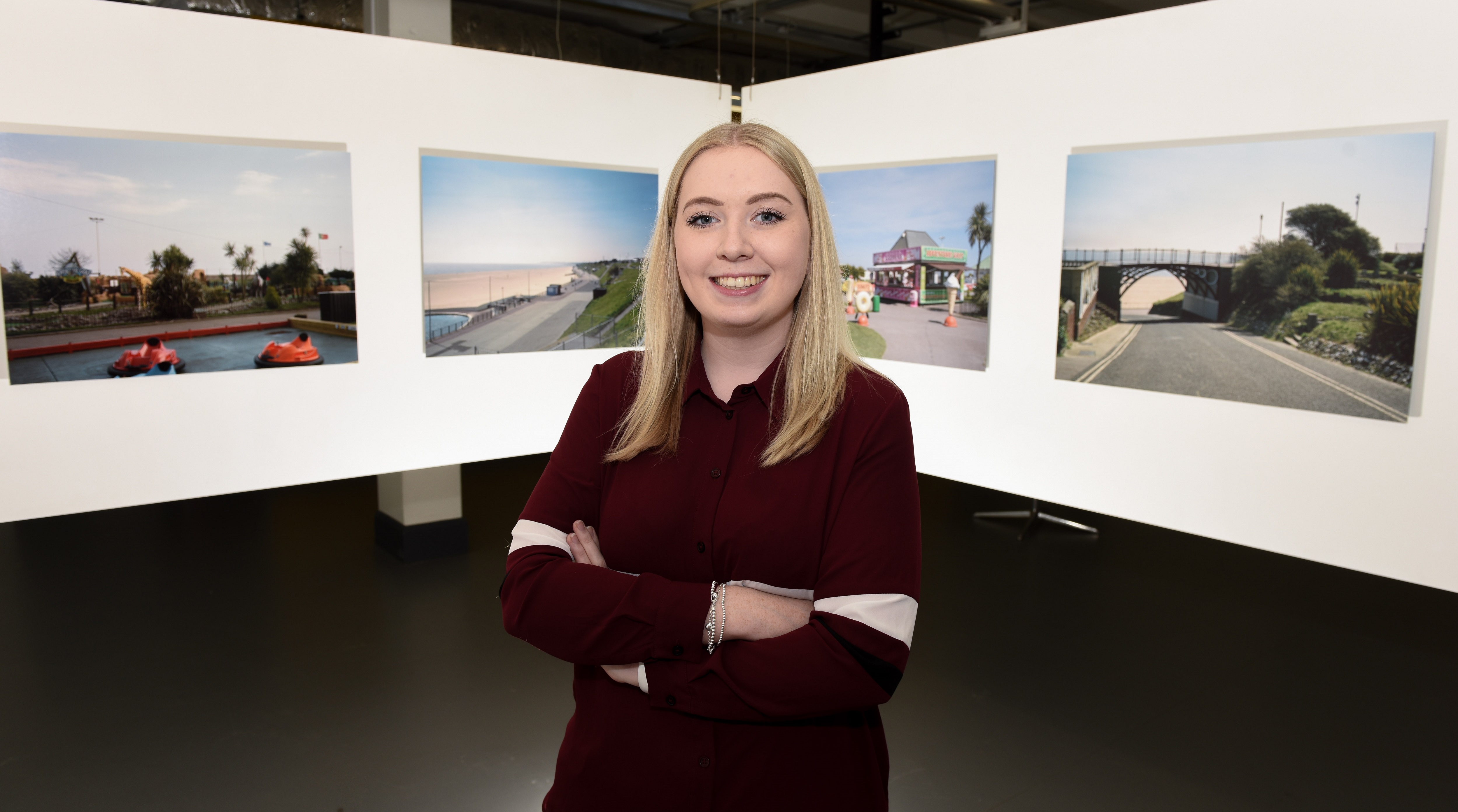 Lucy Scott in front of her work