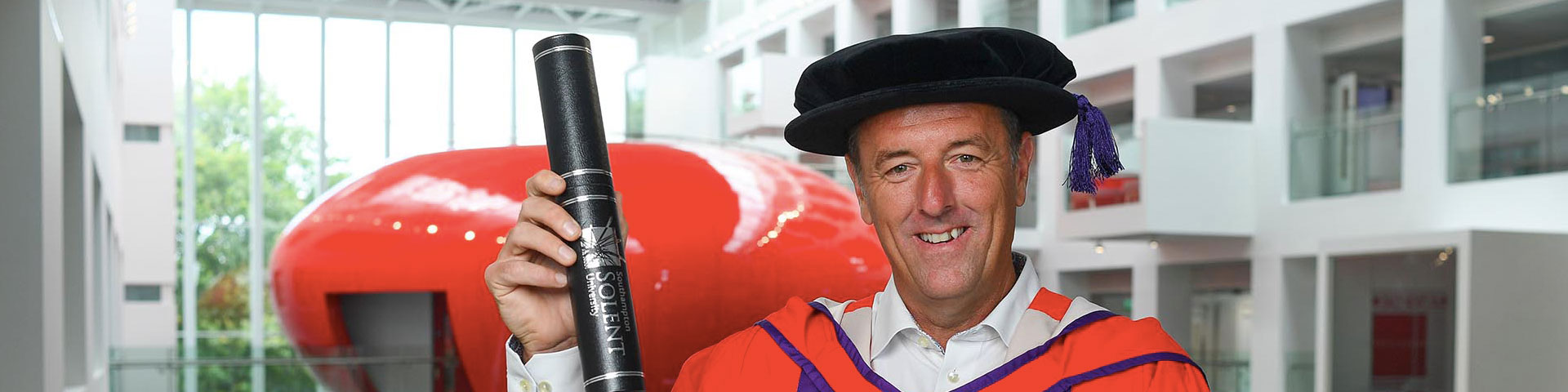 Saints legend, Matt LeTissier with his honorary degree from Solent University