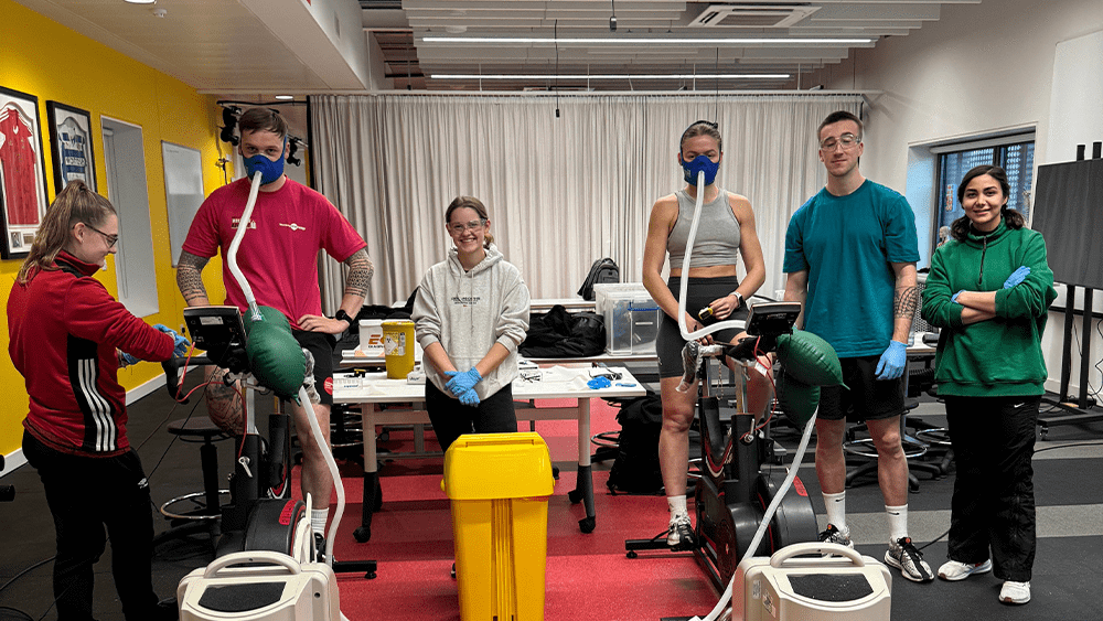 Six students on campus undertaking strength and conditioning tests.
