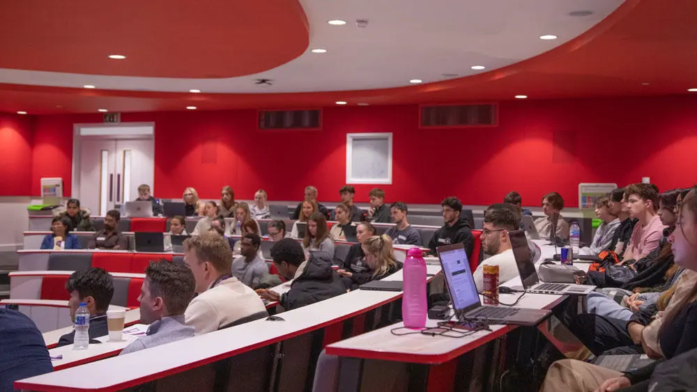 A room full of students in the Palmerston lecture theatre.