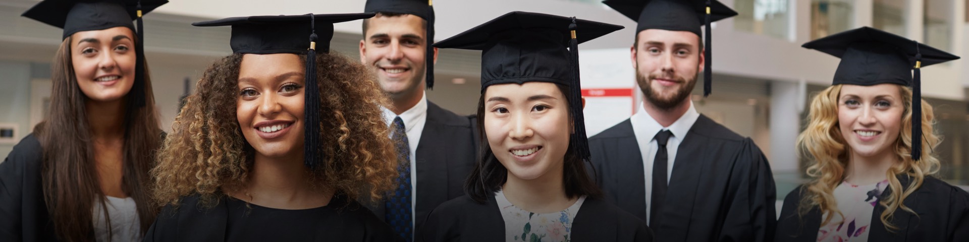 A group of graduates wearing caps and gowns