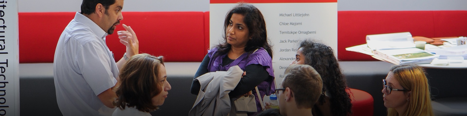 A group of people talking at a networking event