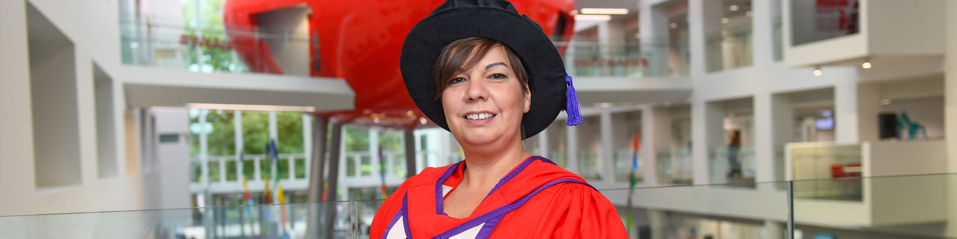 Nina Hartstone in her ceremonial gown in The Spark atrium